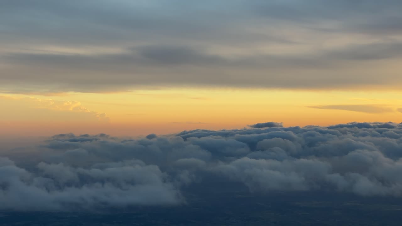 Colorful sunset from a jet cabin during cruise at 7000m high