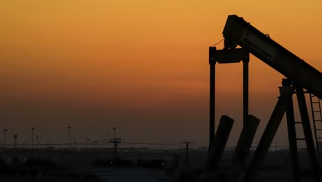 oil pump time lapse at sunset - pan