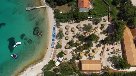 clear and clean beach and sea water in a resort at korcula croatia - aerial shot