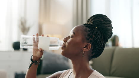 fitness, black woman and drinking water in bottle