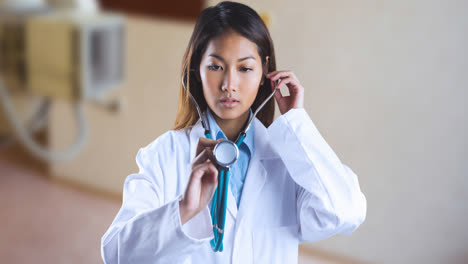 animation of asian female doctor with stethoscope over surgeon room