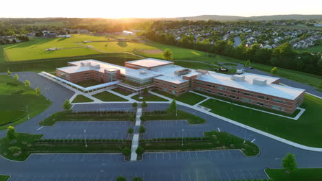 high aerial orbit around large new elementary school in america