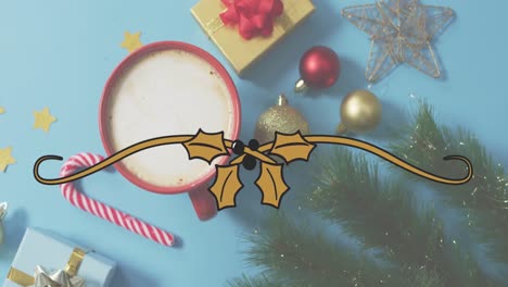 Animation-of-mistletoe-ribbon-banner-with-copy-space-over-hot-chocolate-and-christmas-decorations