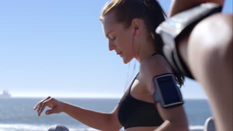 two athletic friends stretching on promenade before run