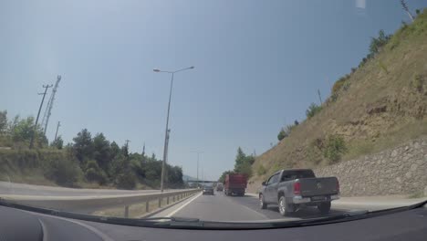 city, nature and traffic view from the camera inside the vehicle.