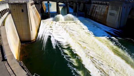 water rushing through a dam spillway