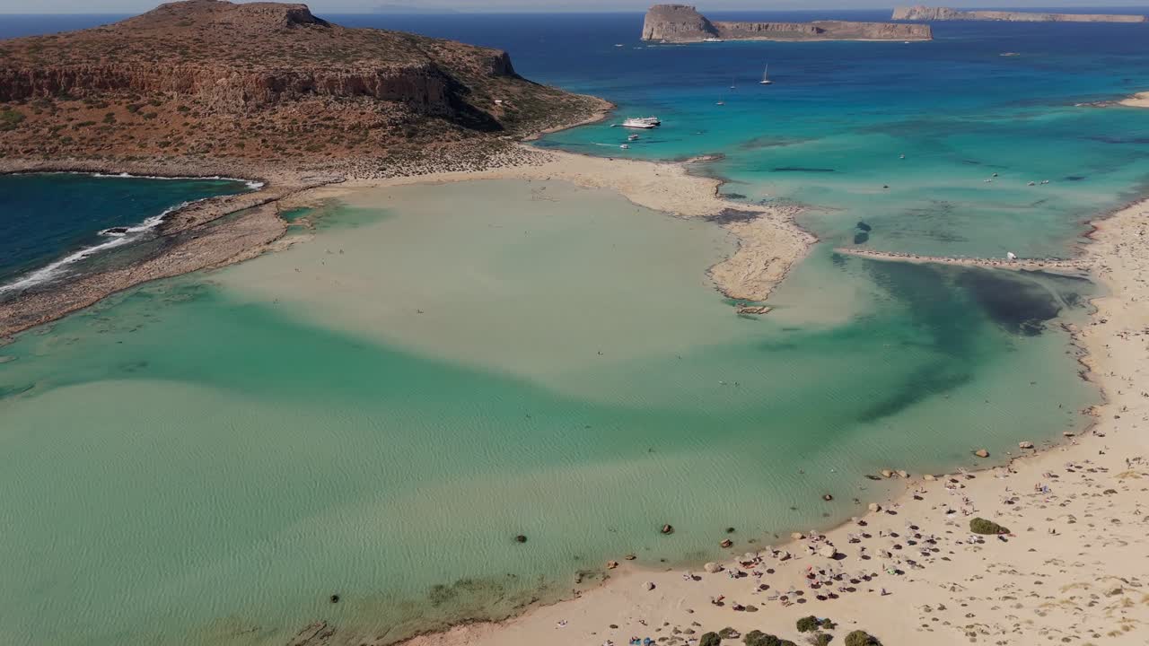 Aerial - turquoise waters and sandy shore at Balos Lagoon, Crete, Greece