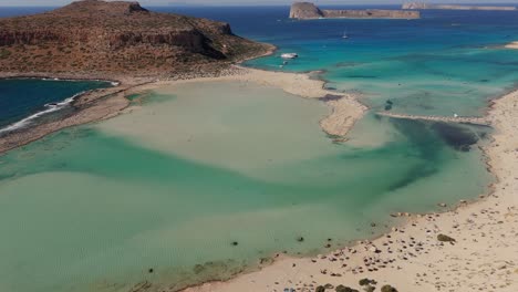 aerial - turquoise waters and sandy shore at balos lagoon, crete, greece