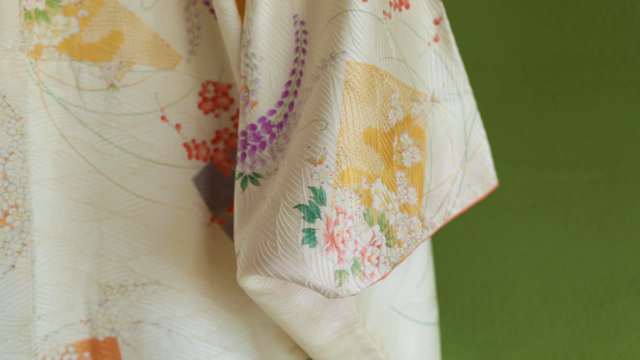 A Traditional Japanese Kimono for a Woman Hanging in an Old Traditional Japanese House