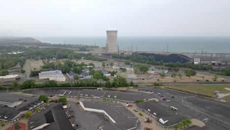Generating-power-plant-in-Michigan-City,-Indiana-along-Lake-Michigan-with-drone-video-moving-in