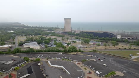 generating power plant in michigan city, indiana along lake michigan with drone video moving in