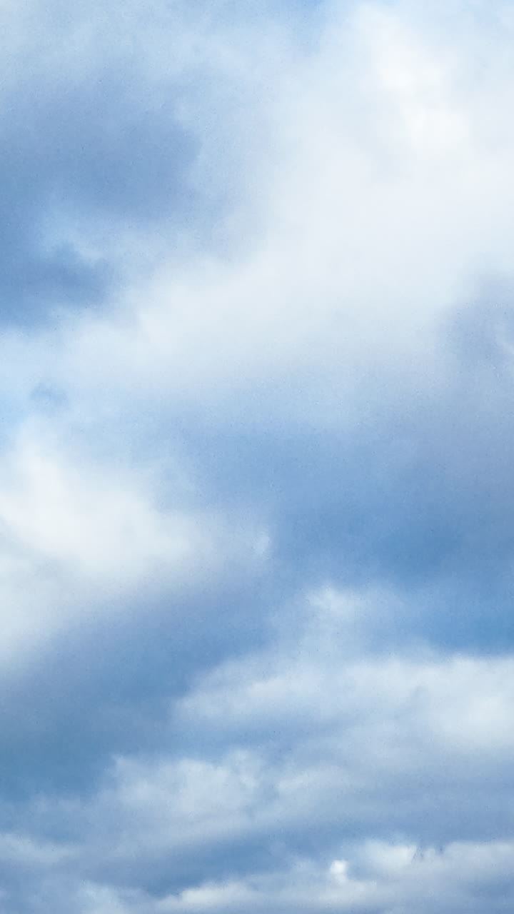 Clouds flowing on blue sky. Summer beautiful outdoor cloudy sky.