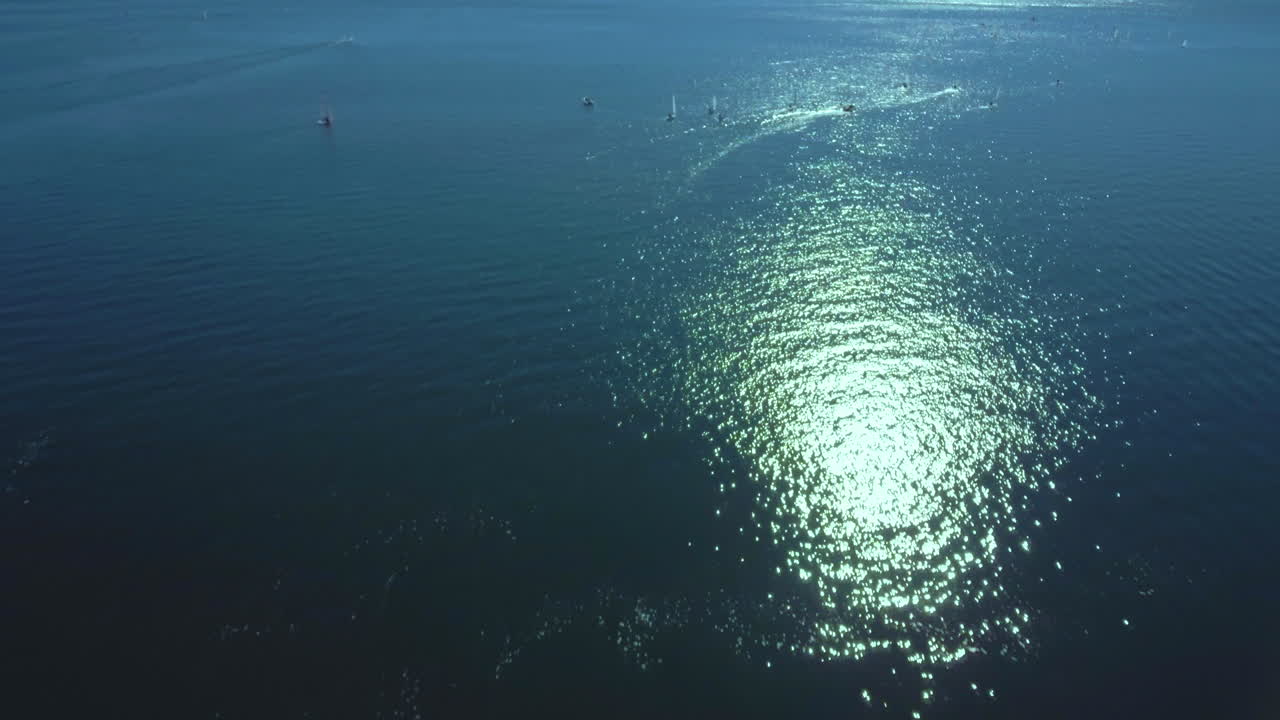Drone view of boats sailing at contest. Aerial view of flying over sea.
