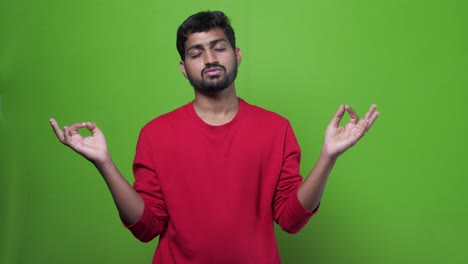 Stressed-young-bearded-Indian-man-thinking-and-looking-down