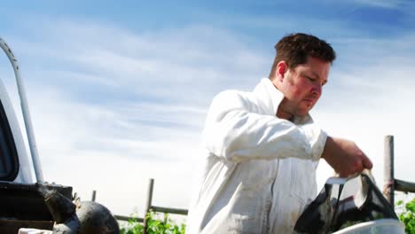 Beekeeper-wearing-protective-mask-in-apiary