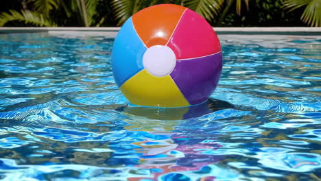 colorful beach ball floating in a swimming pool