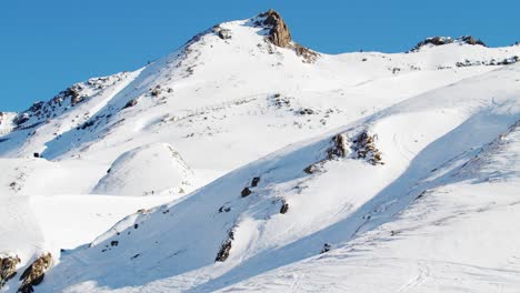 High-alpine-mountain-landscape-with-fresh-snow-on-a-cold-and-sunny-winter-day