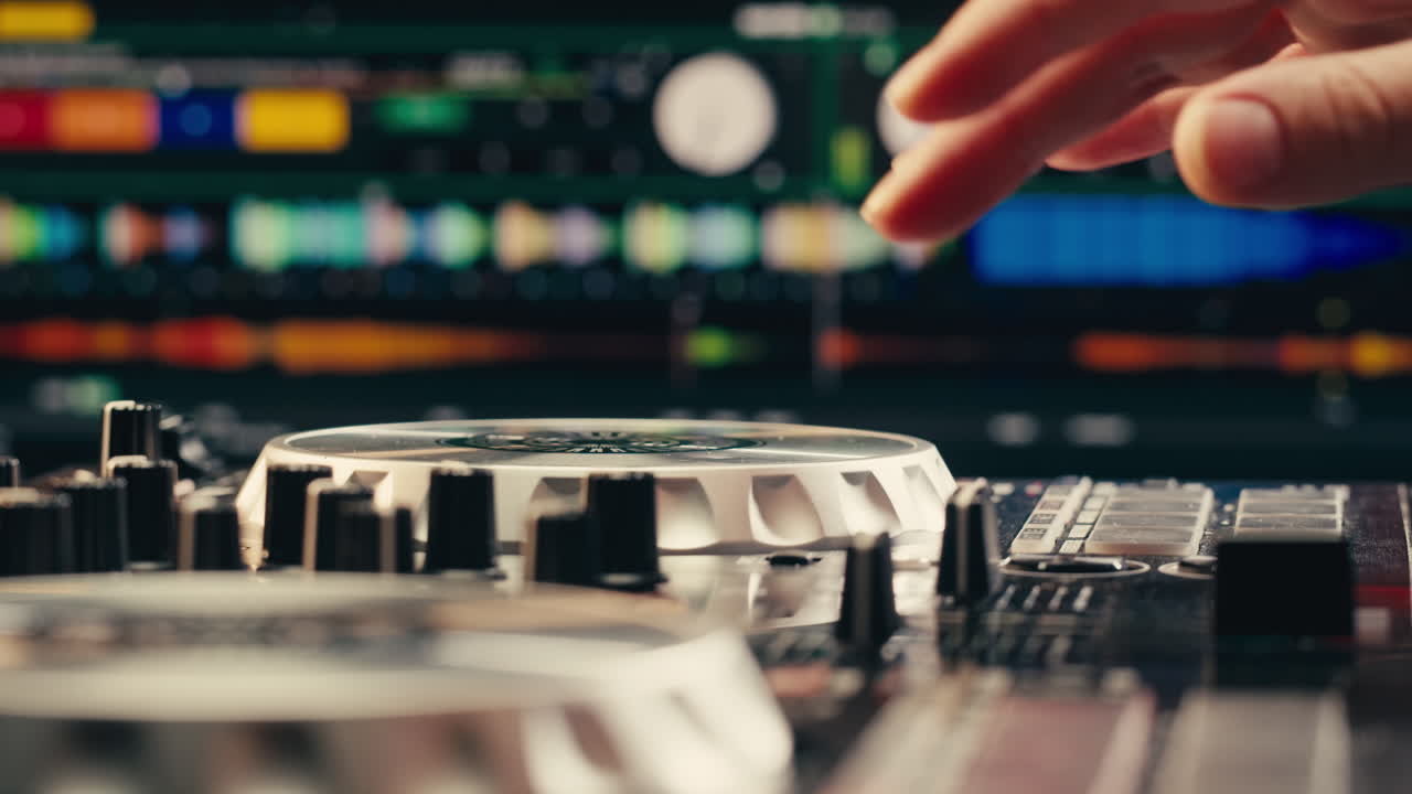 DJ with headphones and sunglasses playing music on festival in night club. Techno musician performing at nightclub for concert crowd of people, city bar.