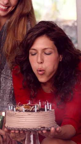 vertical video of a caucasian woman celebrates her birthday at home