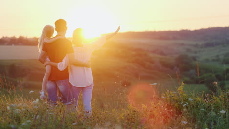 A-Friendly-Family-Spends-Time-In-Nature-Hugs-And-Enjoys-The-Sunset