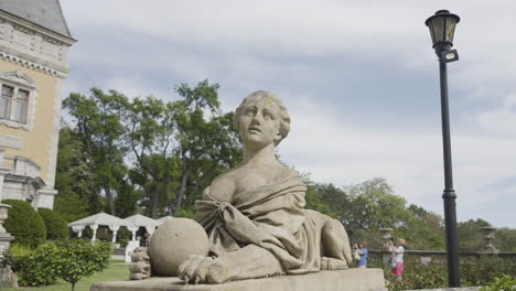 statue of a woman in a garden