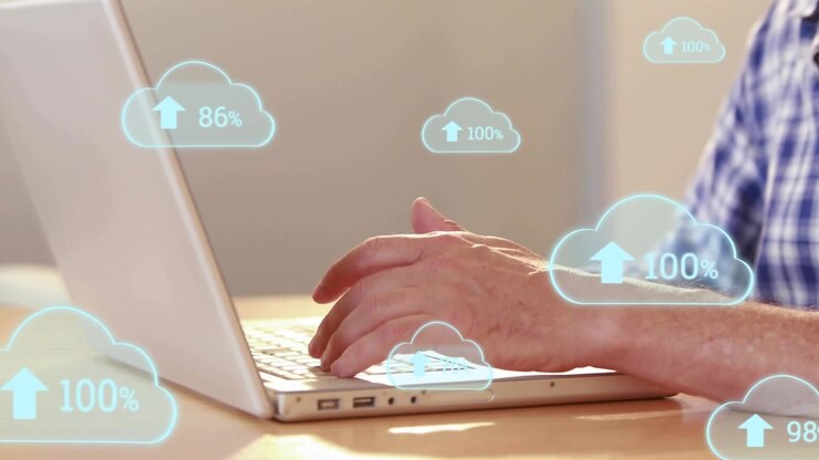 Animation of digital clouds with percent processing over businessman using laptop
