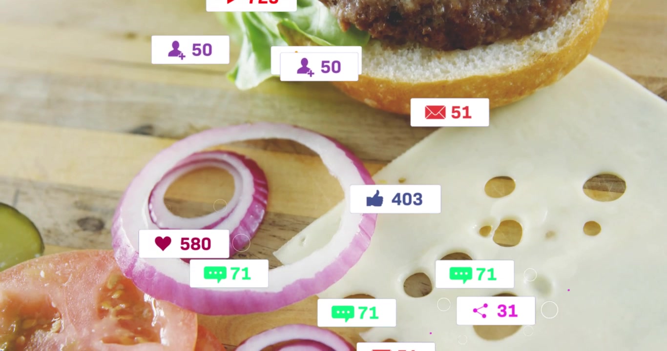 Burger resting on wood board mouse clicking social media badges raising counts onion ring moving