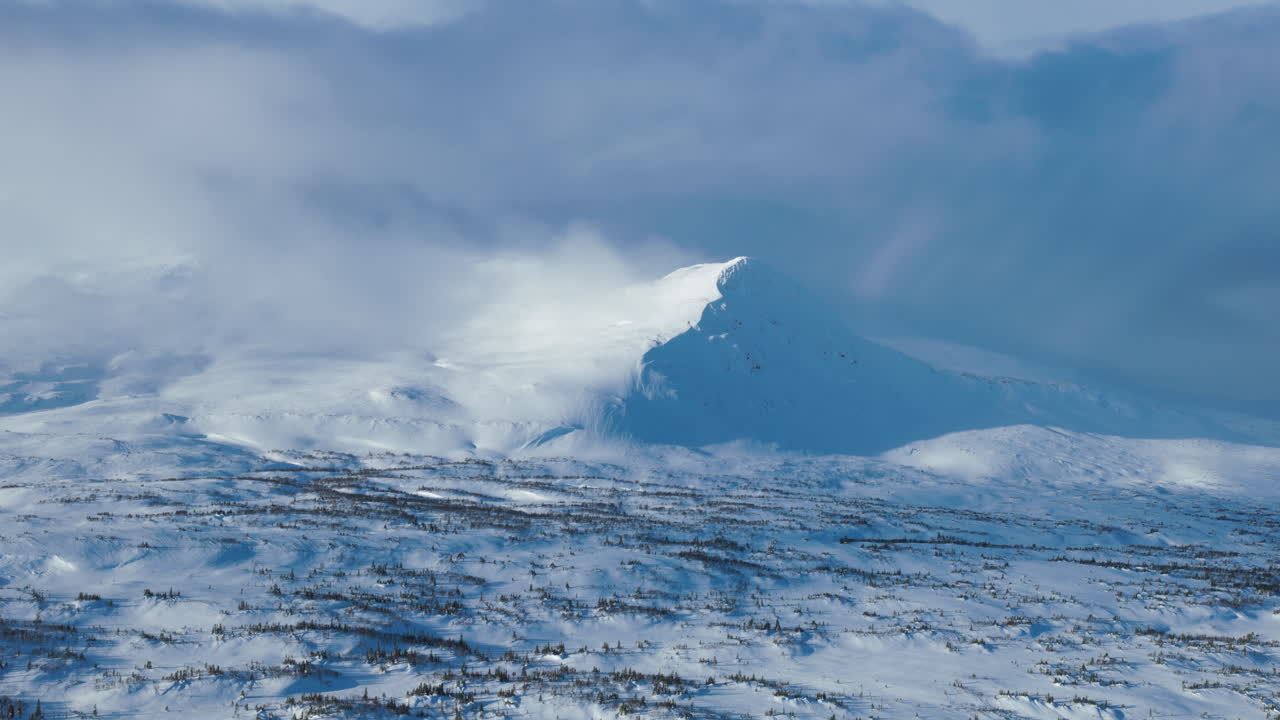 Wind blowing clouds over Åreskutan, Sweden