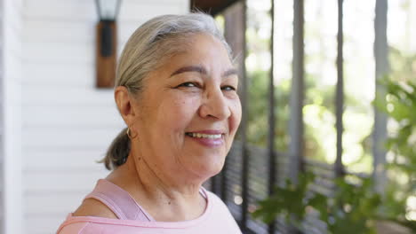 portrait of happy biracial senior woman in sunny outdoors, copy space