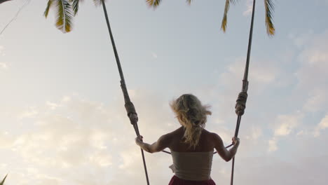 slow-motion-woman-swinging-over-jungle-at-sunrise-travel-girl-enjoying-exotic-vacation-on-swing-in-tropical-rainforest-holiday-lifestyle-freedom-4k
