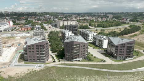 beautiful ascending view of 3 apartment buildings in aerial drone shot