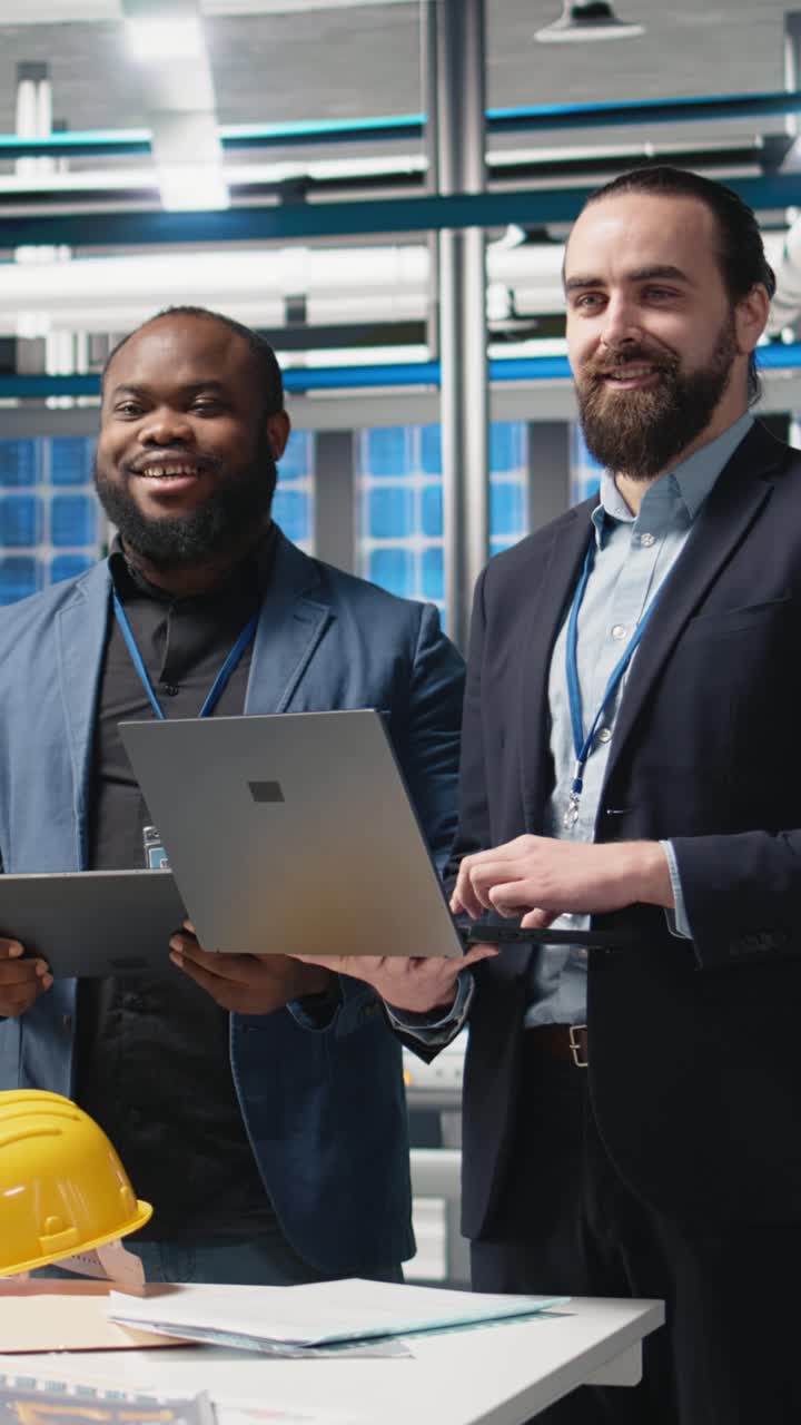 Vertical Video Multiethnic business associates and engineers gather for a discussion