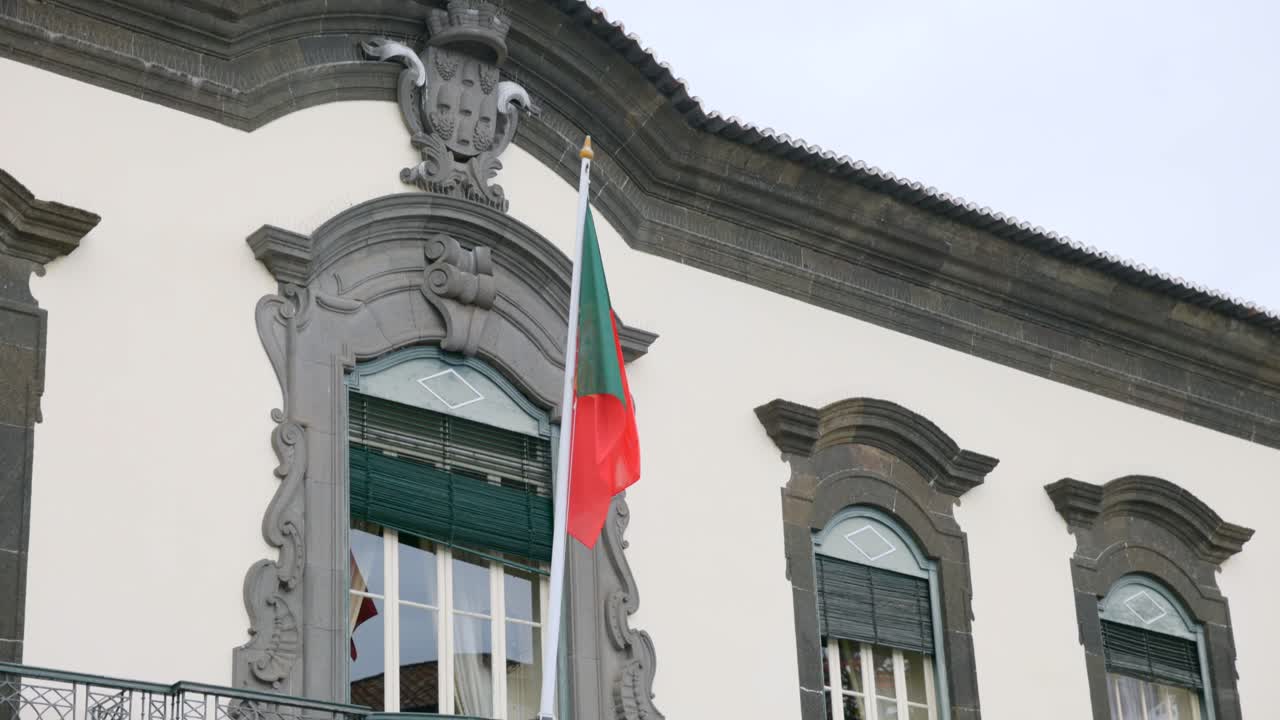 National Flag In Front Of Funchal City Hall In Praca do Município, Sao Martinho, Funchal, Portugal. Close-up Shot