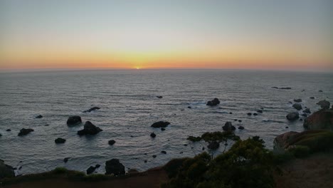 Aerial-view-of-the-sun-setting-over-the-West-Coast's-horizon-in-America