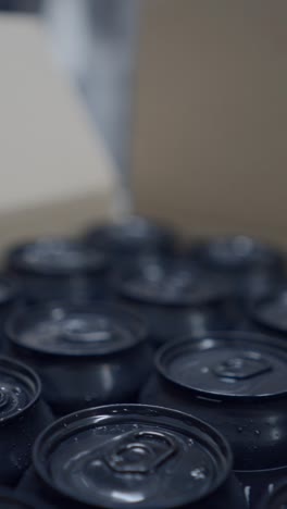 close-up of beverage cans on a production line