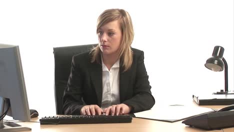 Business-Woman-Working-at-Desk