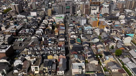 fly over residential neighborhood in the cityscape of kyoto, japan