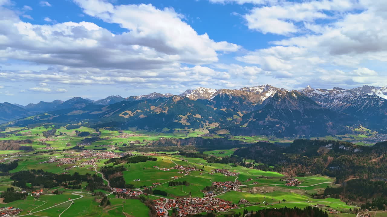 Little town locating in the valley surrounded by picturesque mountains. Aerial view on Bolsterlang, Bavaria, Germany.