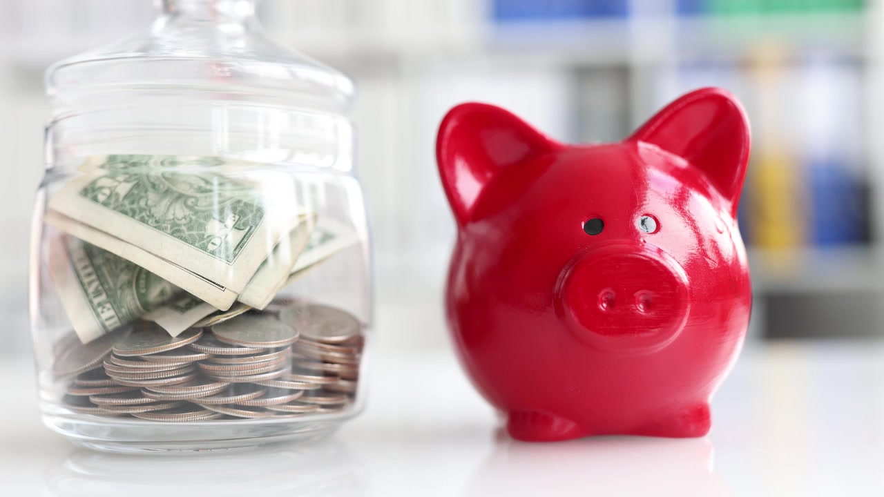 Using a savings jar and red piggy bank can significantly enhance your financial growth