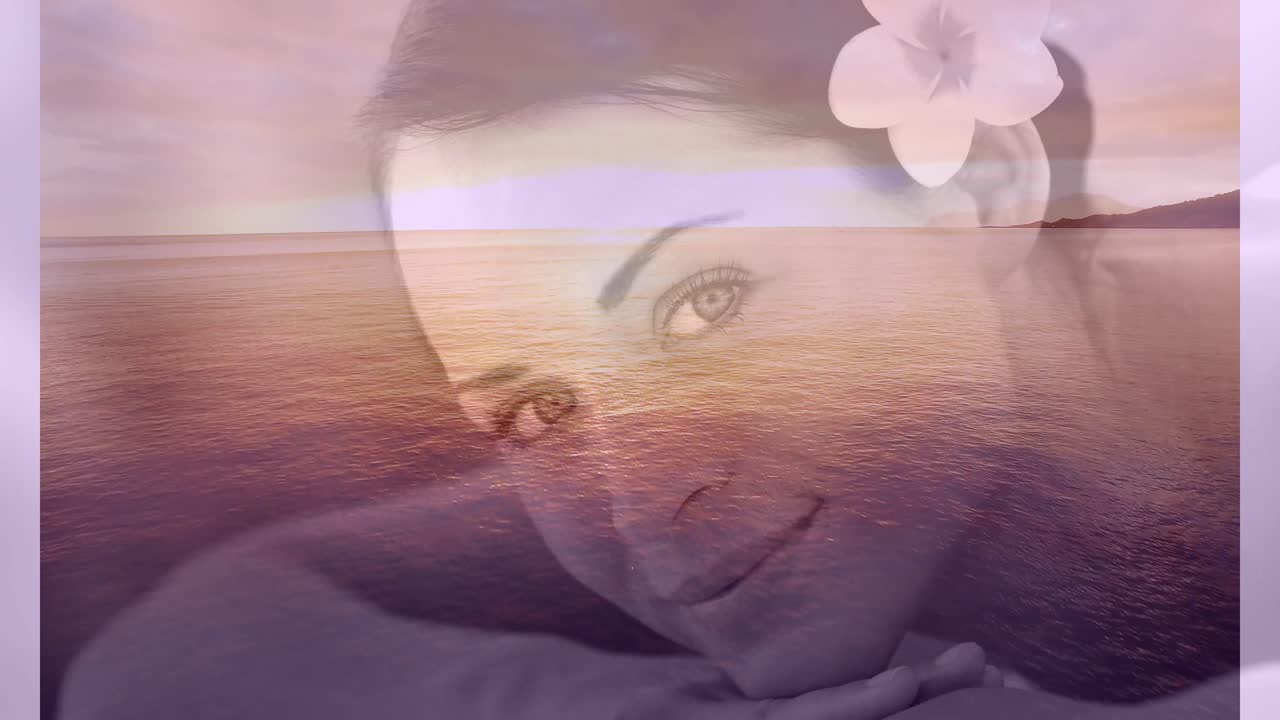 발렌타인 데이 4k에 꽃과 바다 풍경을 가진 편안한 미소 짓는 여성