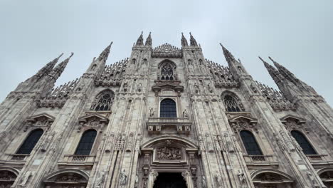 milan cathedral with birds passing by