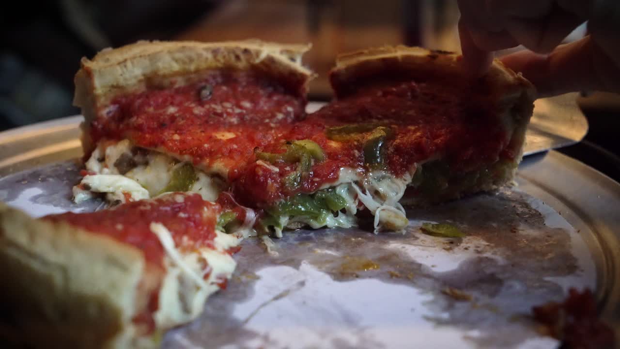 Eating deep dish famous Chicago pizza in the restaurant