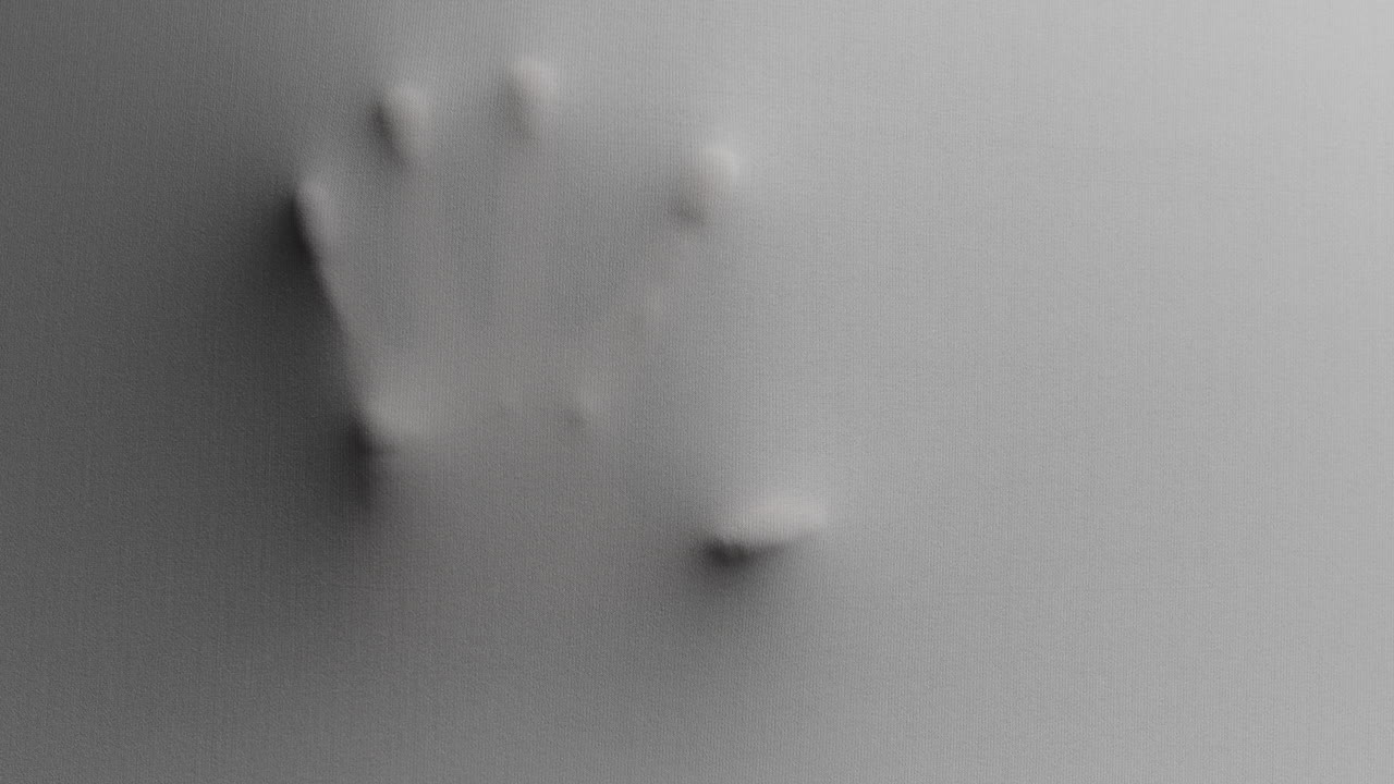 Creepy silhouettes of a woman's hands appears from the white surface