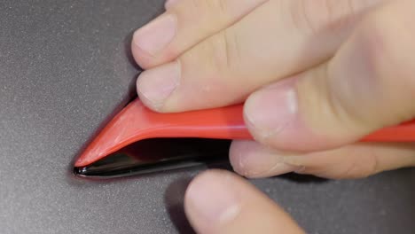 herramienta de plástico que aplica la película de protección de pintura del automóvil en una costura pequeña cu