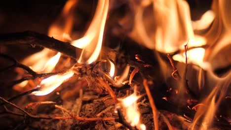 cinematic shot of burning log fire flames in fireplace close-up slow motion