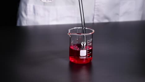 laboratory experiment with red liquid in a beaker