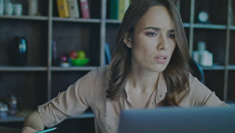 serious businesswoman analysing data on notebook. business woman computer