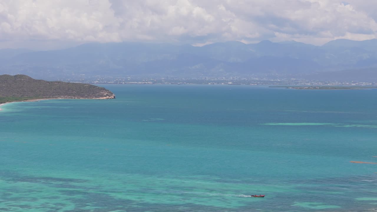 Fishing Boat Sailing On Blue Tropical Water At Hellshire Beach Jamaica