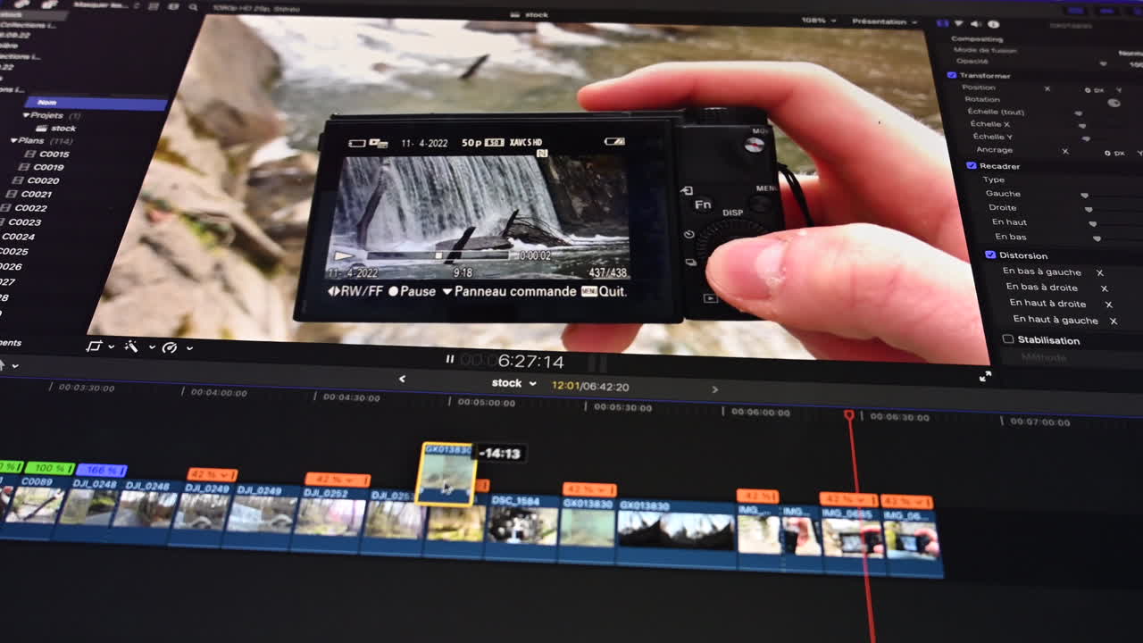 Screen view of an editor editing rushs of a camera in the nature, timeline with slow-no clips