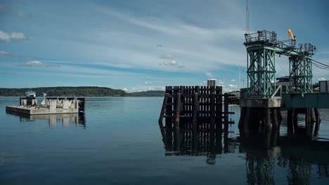 time lapse of the vashon island ferry docking at pt defiance, tacoma washington on a partly cloudy warm spring day